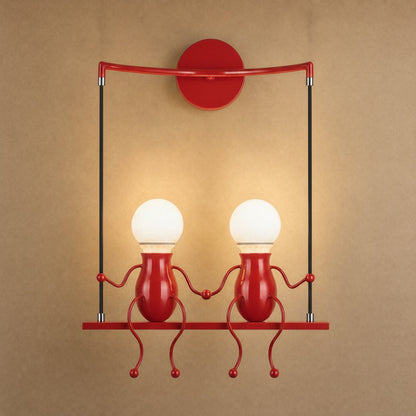 Jyllen red wall light, two figures hand in hand on their swing | Wickleigh