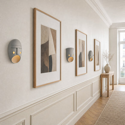 Three Faelin wall lights aligned in a gallery hallway in daylight | Wickleigh