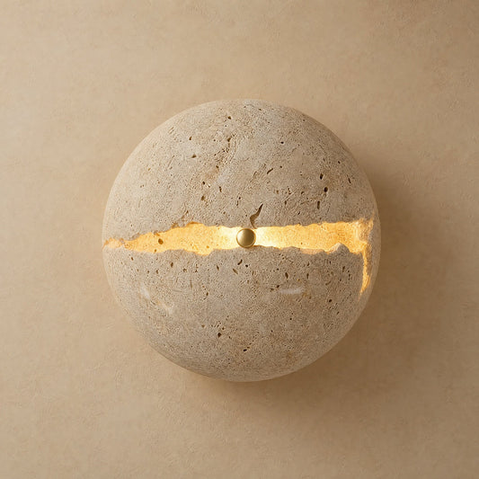 Rinen stone wall light, split yellow travertine sphere with a line of golden light | Wickleigh