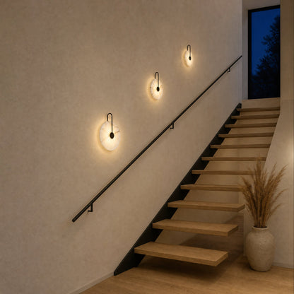 Three Henin marble wall lights, Ø 25, 20 and 16 cm, lit along a staircase | Wickleigh