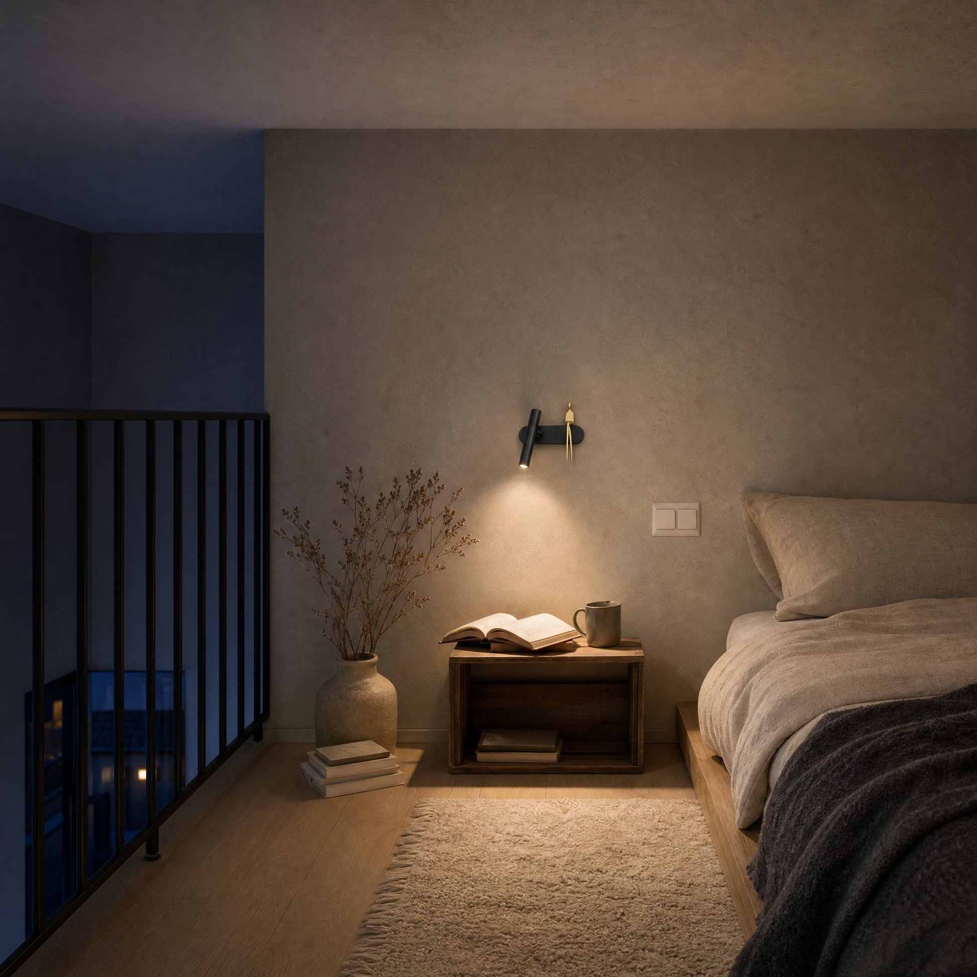 Odron adjustable wall light lit above a mezzanine bed at dusk | Wickleigh