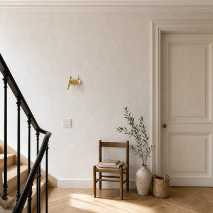 Odron gold adjustable wall light on a townhouse landing in daylight | Wickleigh