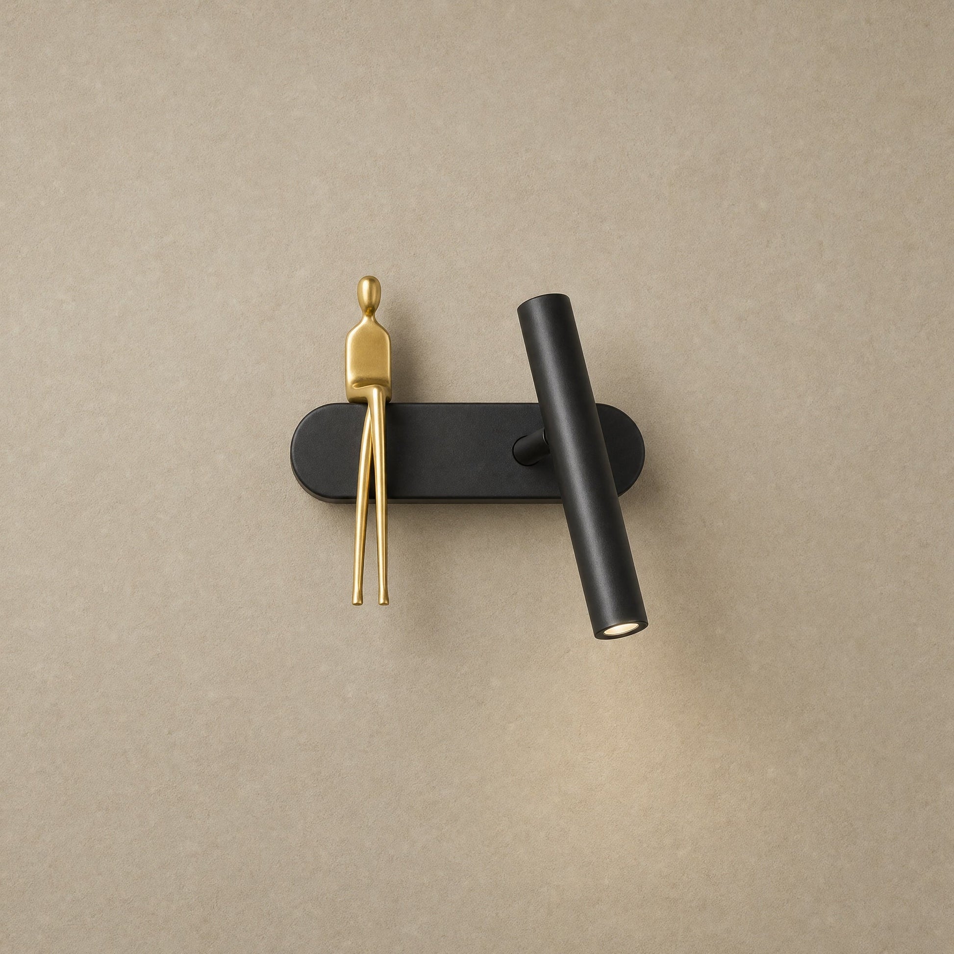 Odron black and gold adjustable wall light, figure on the left | Wickleigh