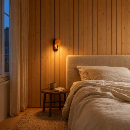 Elmen bedside wall light lit on a pine slat wall, above a linen headboard, early evening | Wickleigh