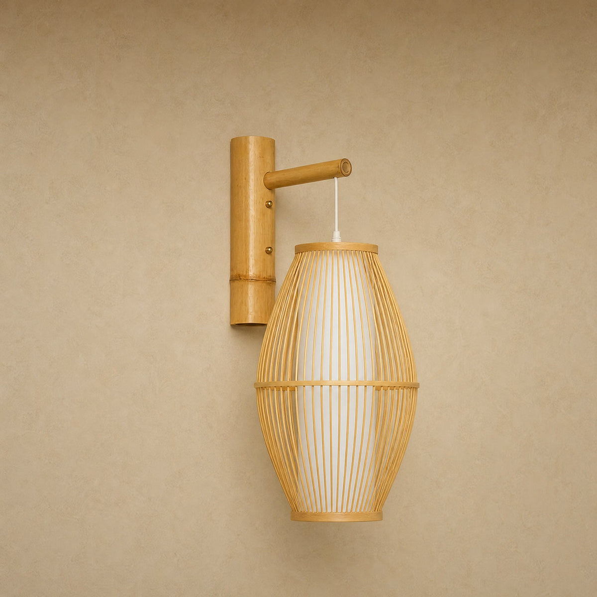Halna natural wall light, woven bamboo cocoon on a wall arm, front view | Wickleigh