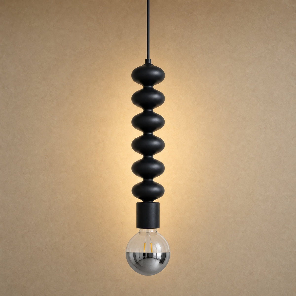 Kavlin pendant light in matte black with half-mirror globe | Wickleigh