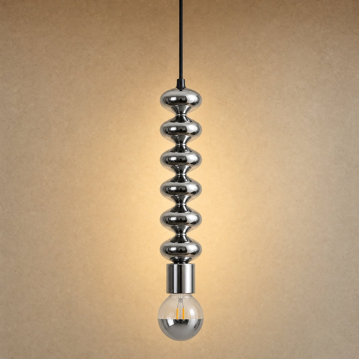 Kavlin pendant light in polished chrome with half-mirror globe | Wickleigh