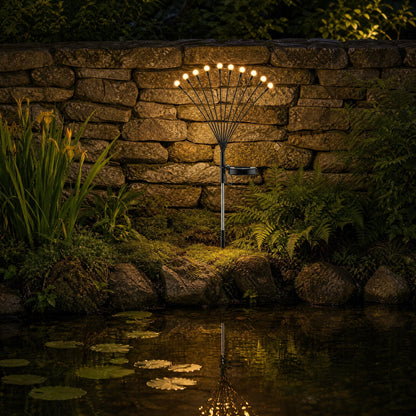 Islin solar fireflies lit beside a garden pond, golden reflections on the water at night | Wickleigh