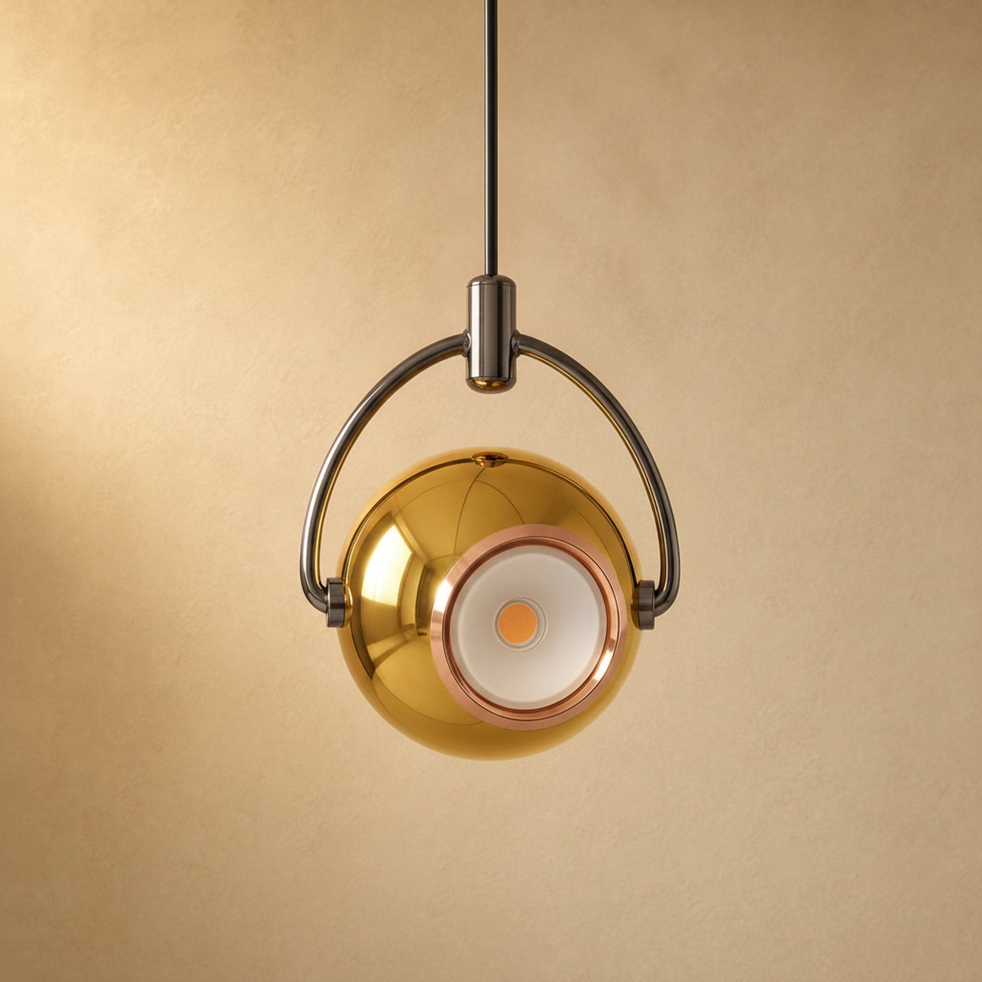 Broin gold pendant light, swivelling lacquered globe | Wickleigh