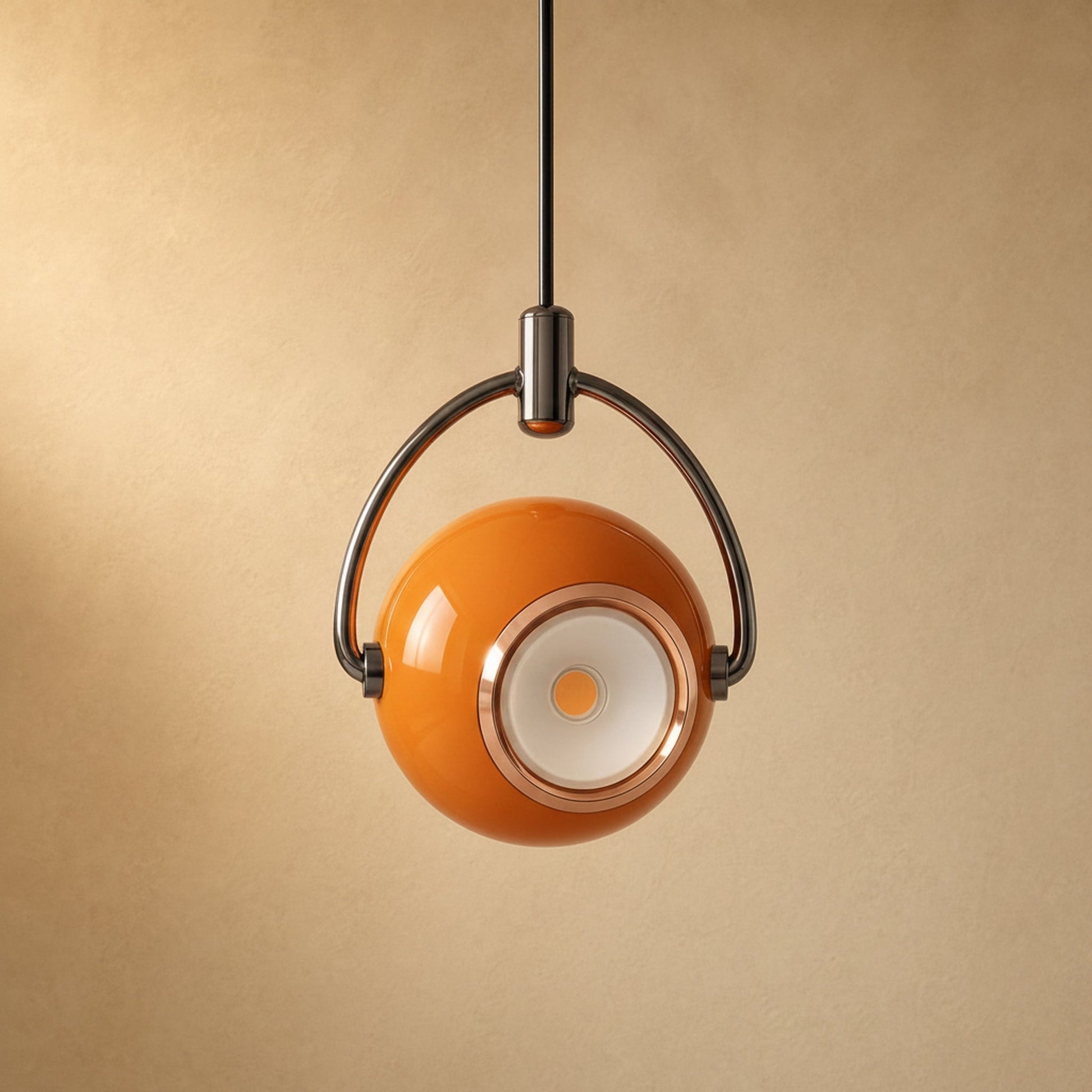 Broin orange pendant light, swivelling lacquered globe | Wickleigh