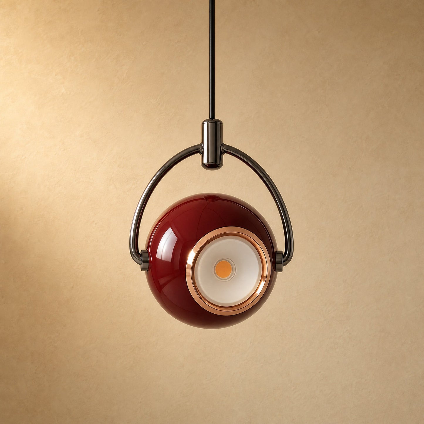 Broin burgundy red pendant light, 12 cm lacquered globe swivelling in its chrome stirrup | Wickleigh