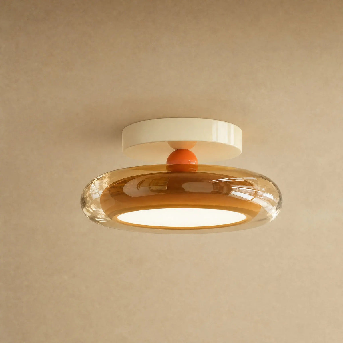 Aswyn ceiling light in amber glass with cream base plate, glass pebble | Wickleigh