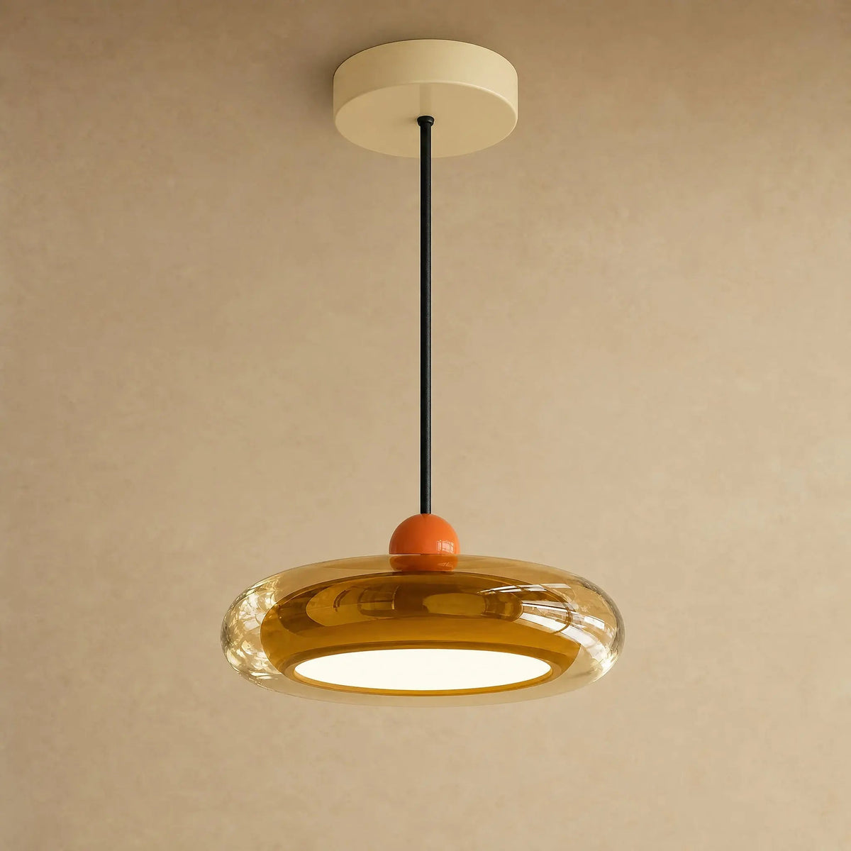 Aswyn pendant light in amber glass with cream base plate | Wickleigh
