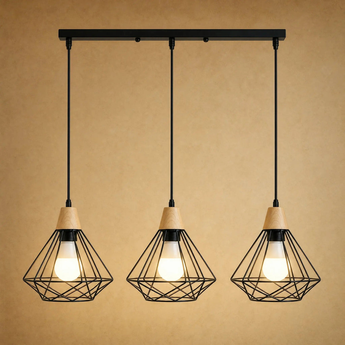 Fyrra industrial pendant light, three heads aligned, black iron diamond cage and light wood | Wickleigh