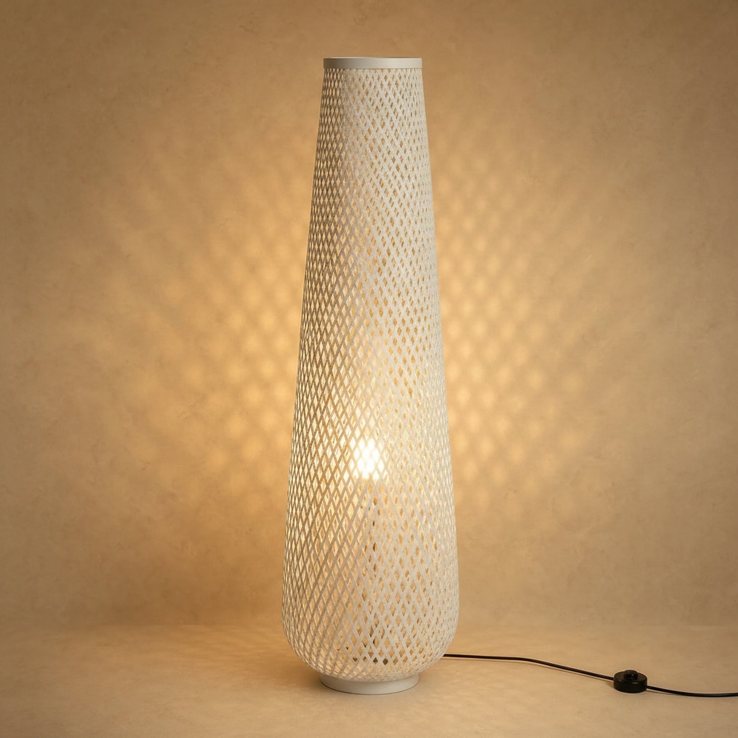 Eirin bamboo floor lamp in white lit, diamond lattice weave | Wickleigh
