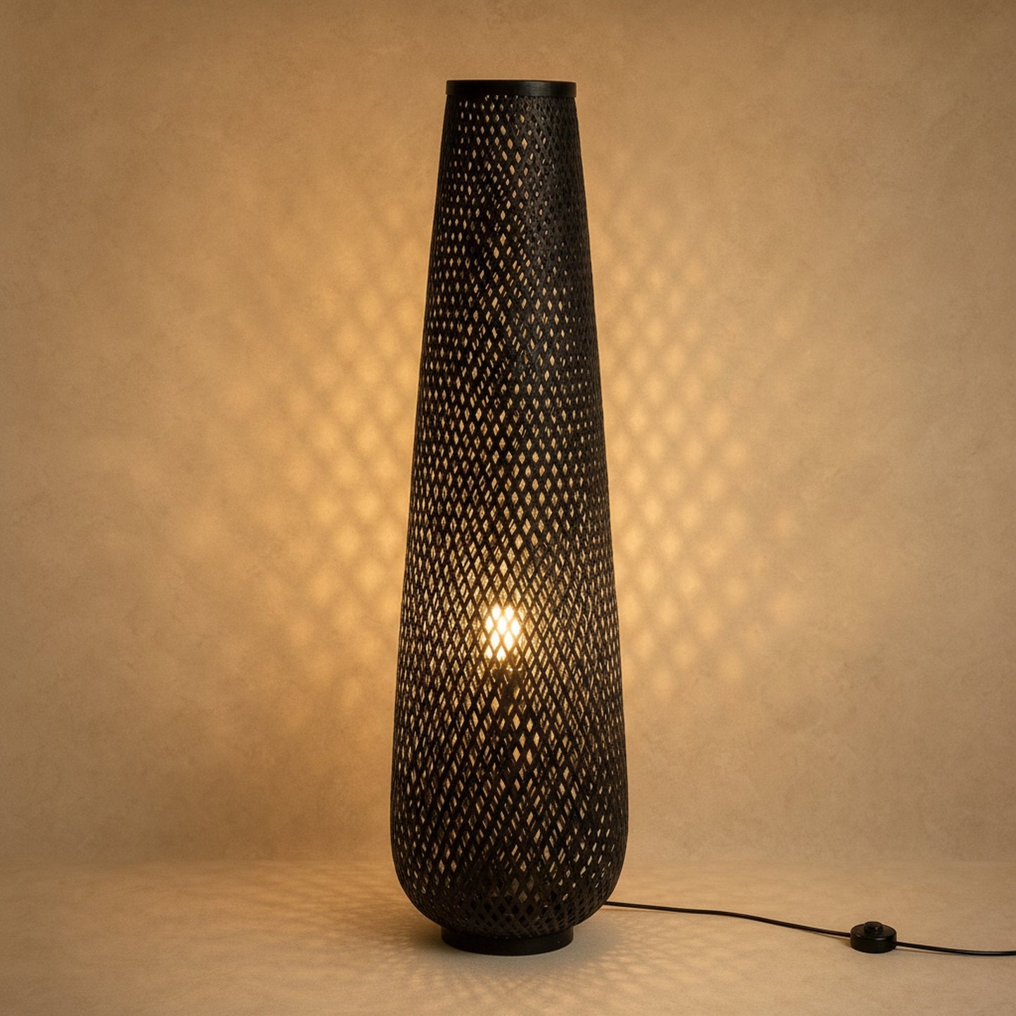 Eirin bamboo floor lamp in black lit, diamond lattice weave | Wickleigh