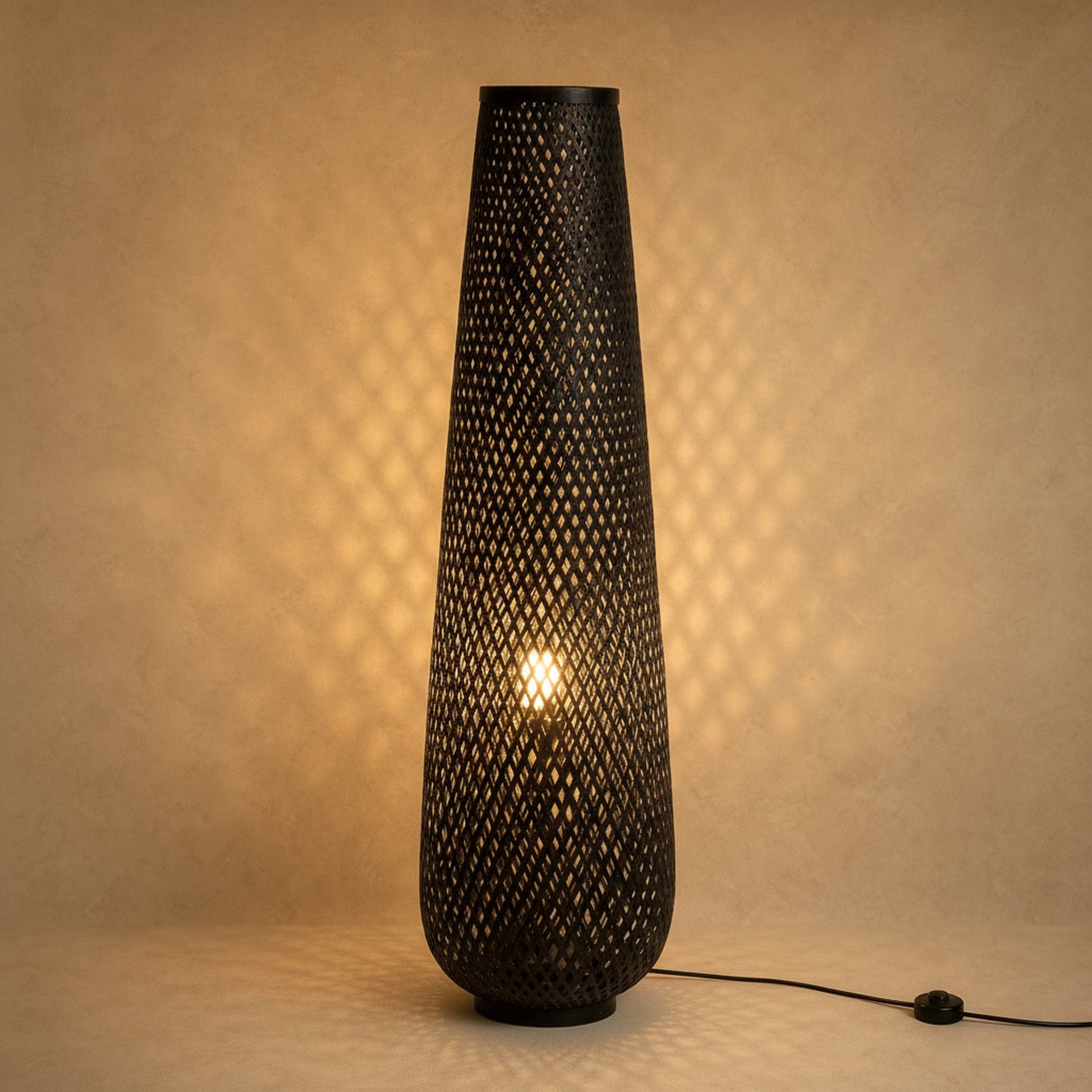 Eirin bamboo floor lamp in black lit, diamond lattice weave | Wickleigh