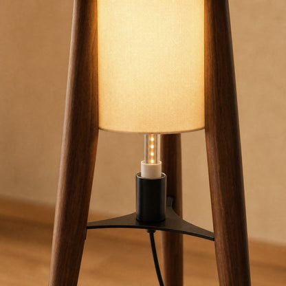 Detail of the wooden legs, black hub and E27 fitting on the Teira floor lamp | Wickleigh