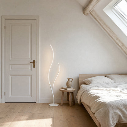 Eyrra matt white LED floor lamp in a daylit attic bedroom | Wickleigh