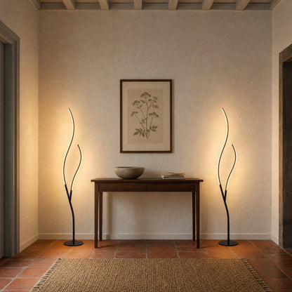 Pair of Eyrra LED floor lamps lit either side of a hallway console table | Wickleigh