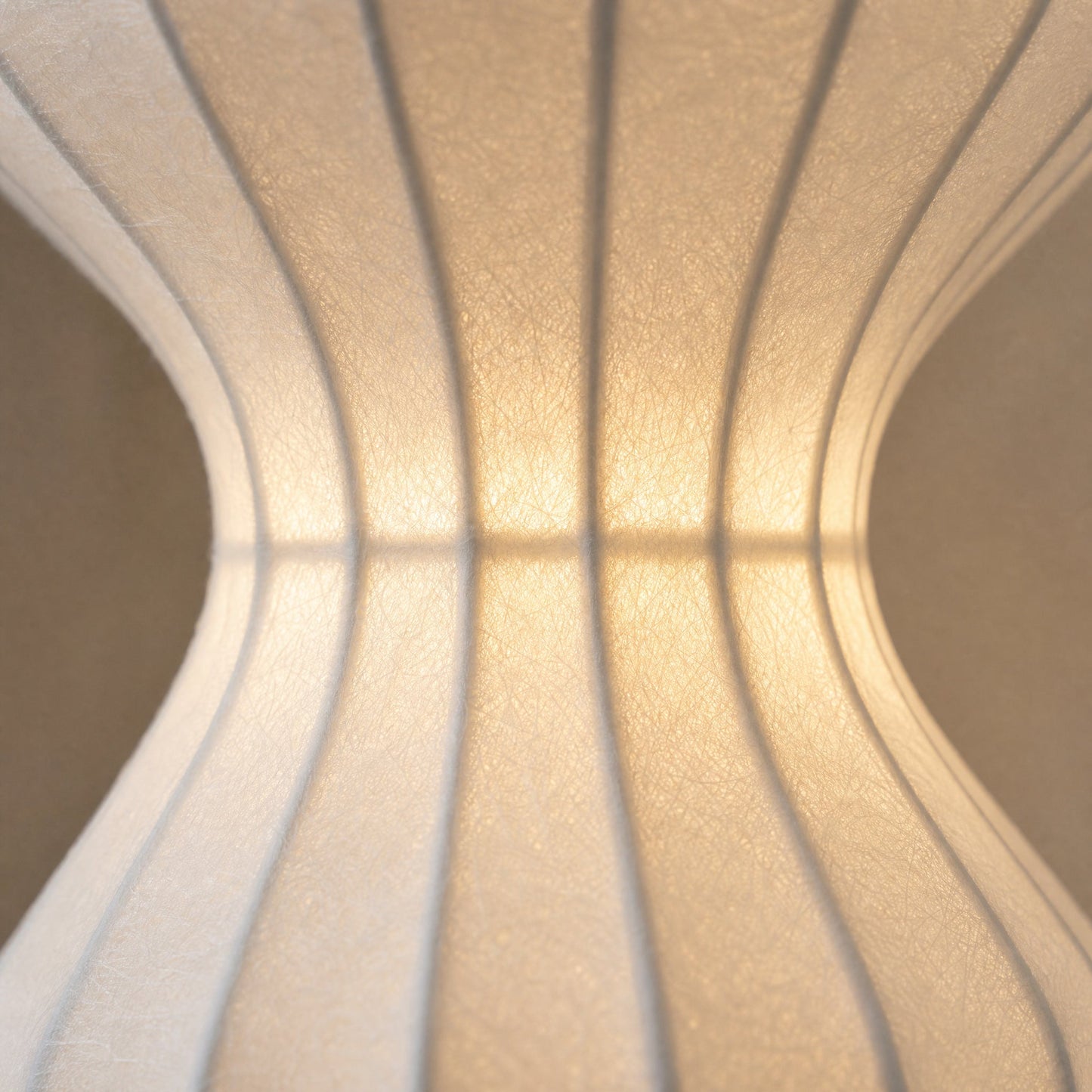Detail of the pinched waist and silk weave lit from within, Pyrren | Wickleigh