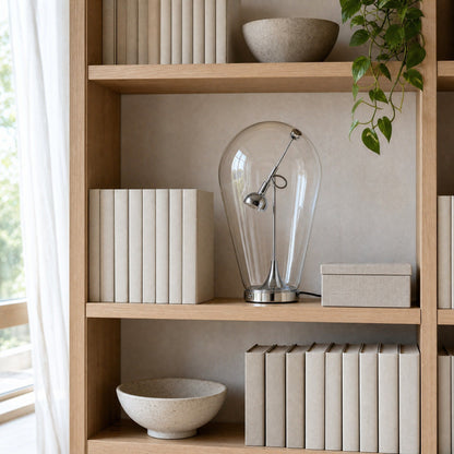 Alrin chrome lamp on a Japandi-style bookshelf in daylight | Wickleigh