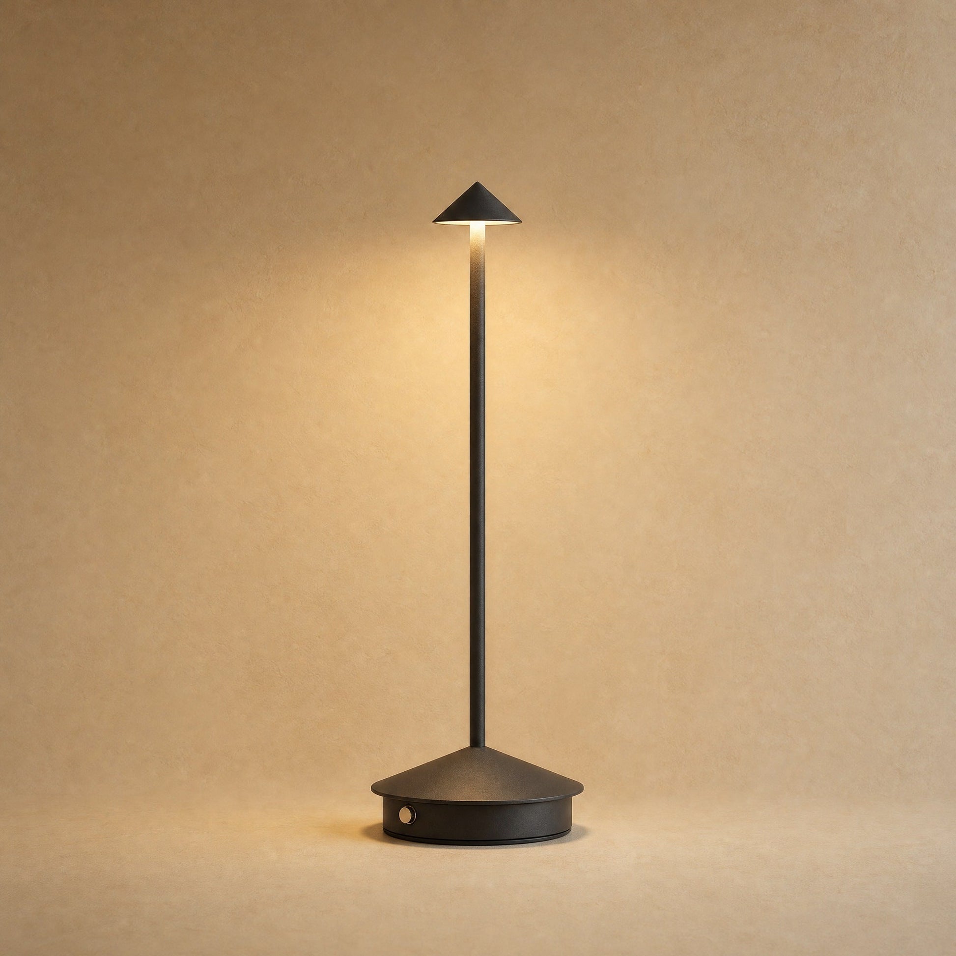 Virren cordless table lamp in matte black aluminium, lit | Wickleigh