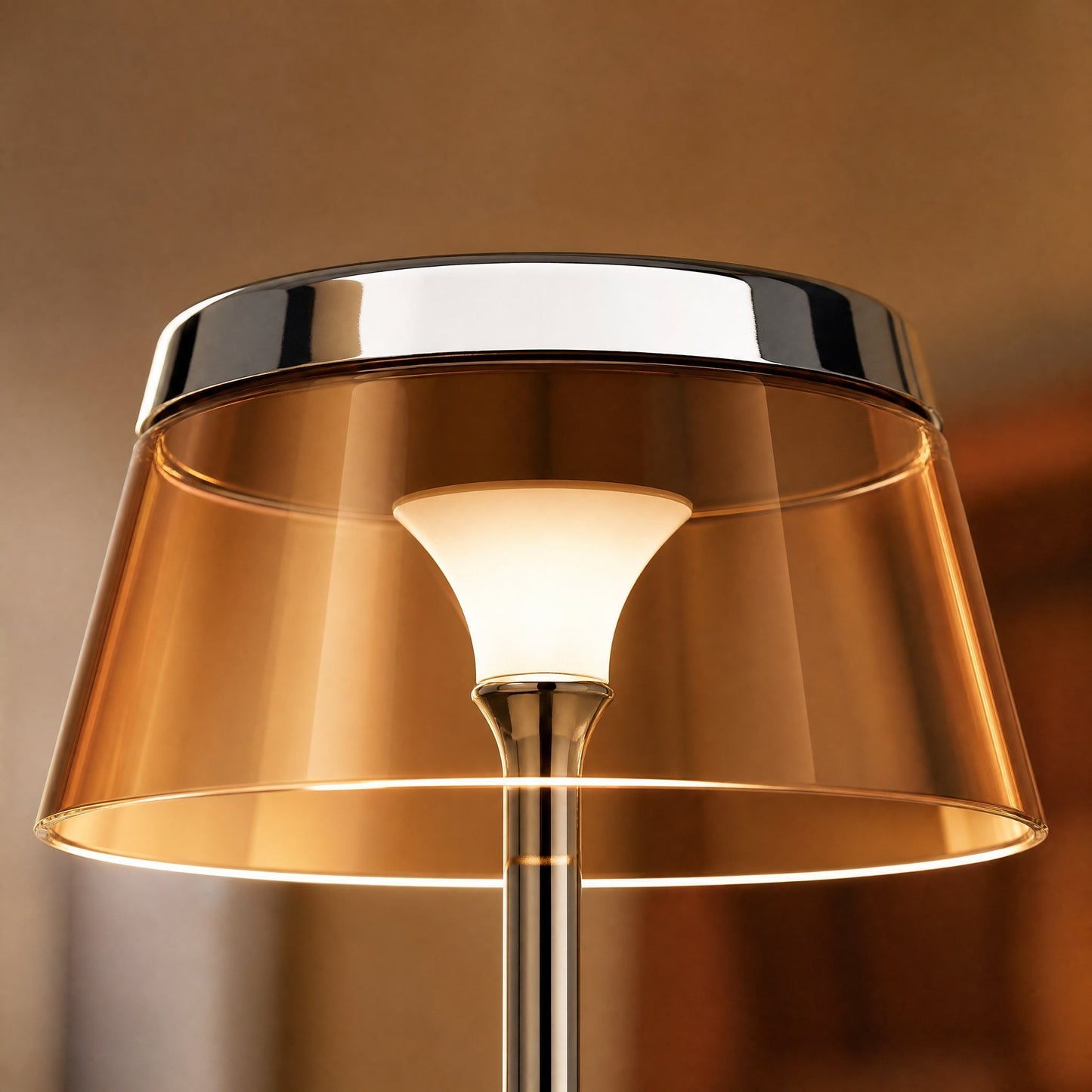 Detail of the chrome crown and amber shade lit from within on the Tylen table lamp | Wickleigh
