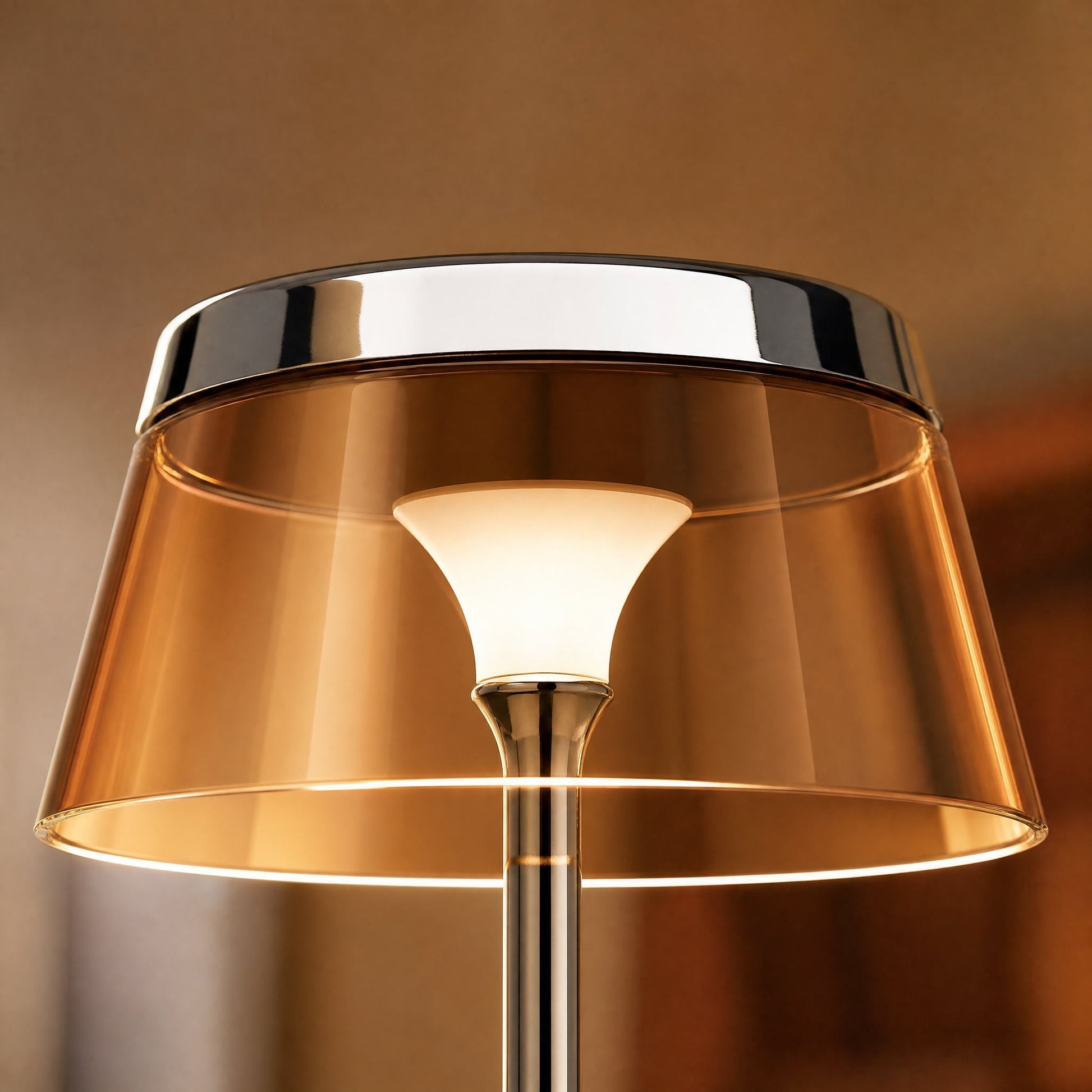 Detail of the chrome crown and amber shade lit from within on the Tylen table lamp | Wickleigh