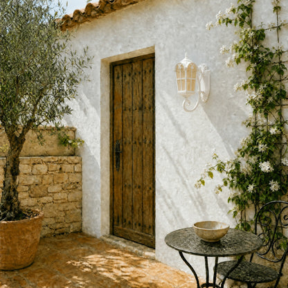 Lovna white outdoor wall lantern mounted beside a wooden door on a patio | Wickleigh