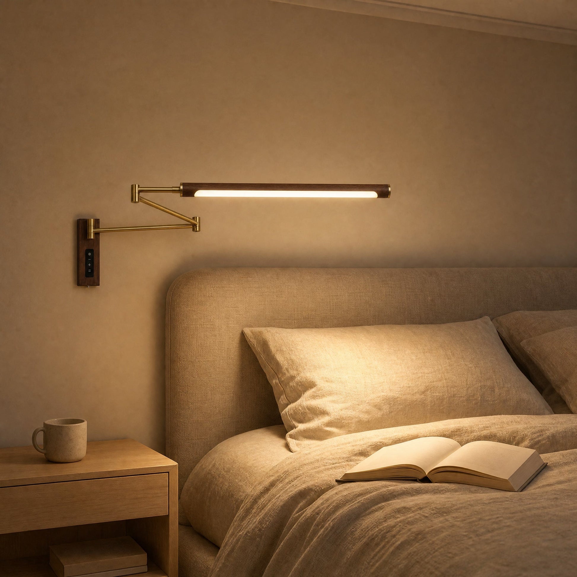 Vinra wall light lit above a bedhead, warm evening atmosphere | Wickleigh