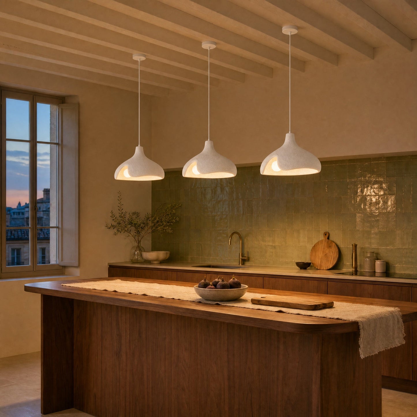 Three white Elrin pendant lights lit above a walnut kitchen island | Wickleigh