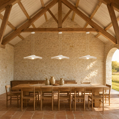 Three Urven white pendant lights aligned above a long table under an exposed timber roof | Wickleigh