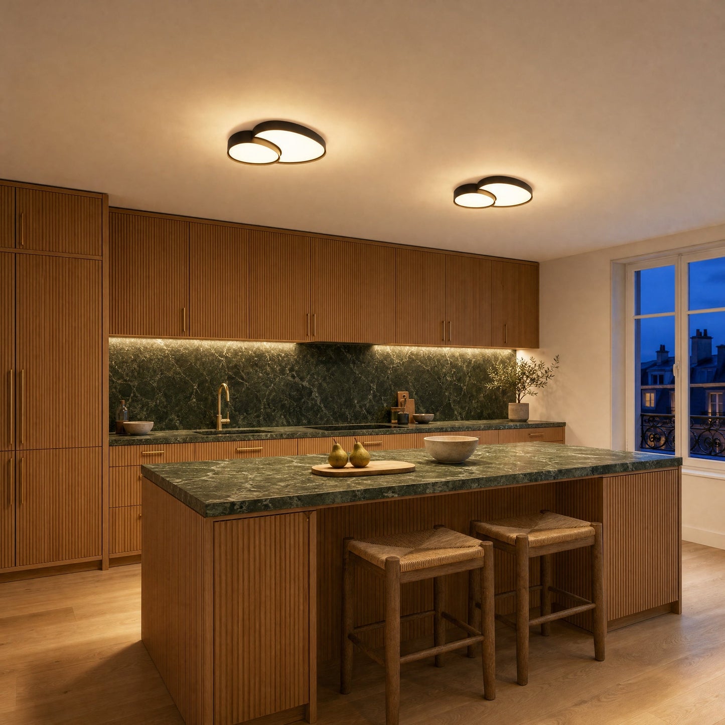 Two Teina black flush ceiling lights aligned above a kitchen with a green marble island | Wickleigh