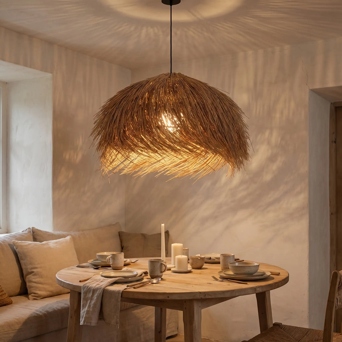 Vadra rattan pendant light, evening dining room scene | Wickleigh