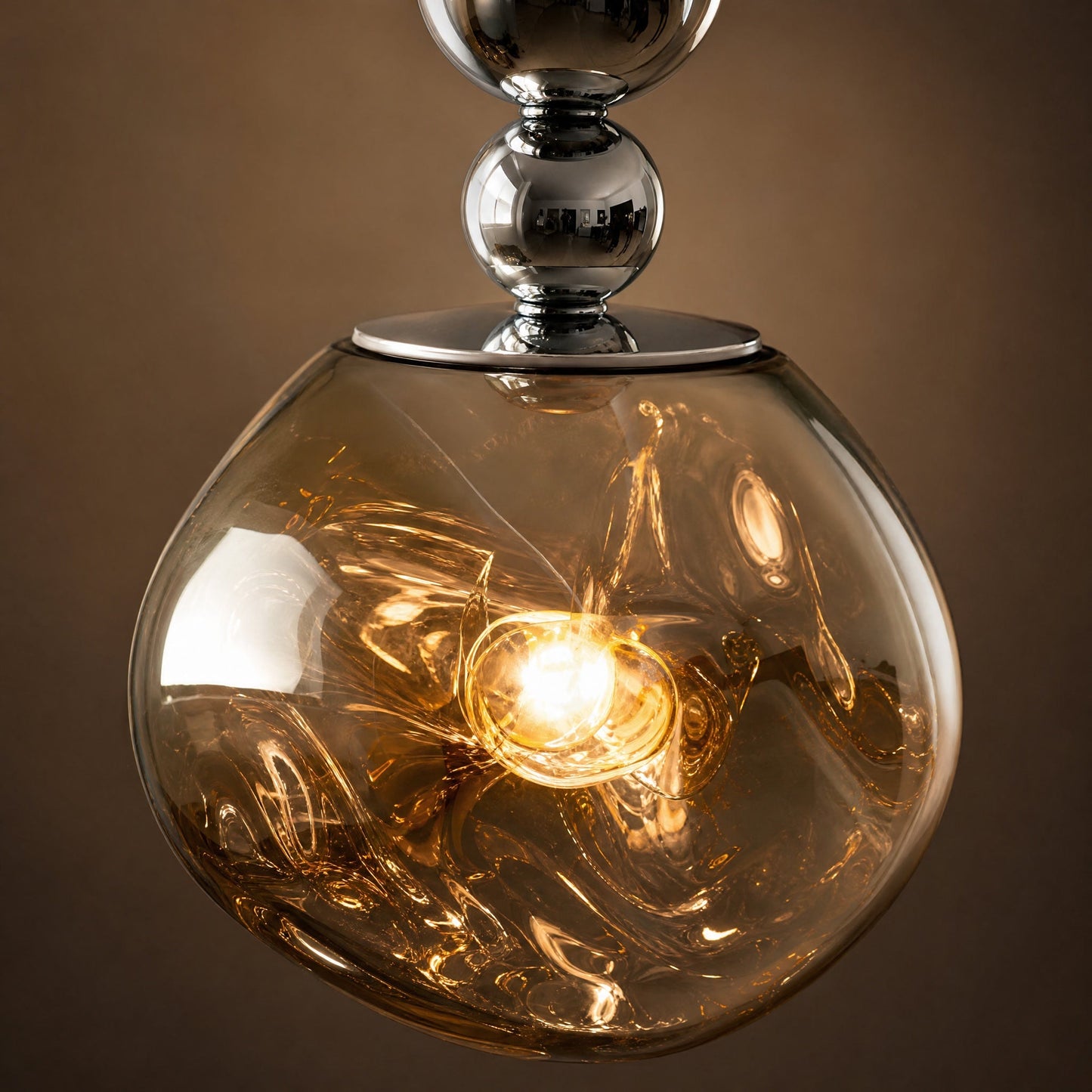 Detail of the Kolna pendant light's translucent cast globe and chromed beads | Wickleigh