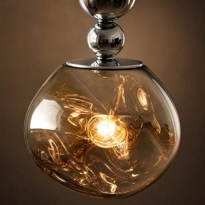 Detail of the Kolna pendant light's translucent cast globe and chromed beads | Wickleigh