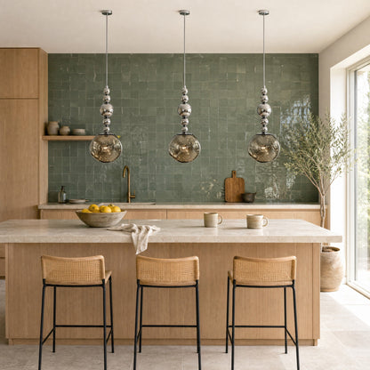 Three Kolna art deco pendant lights aligned above a green tiled kitchen island | Wickleigh