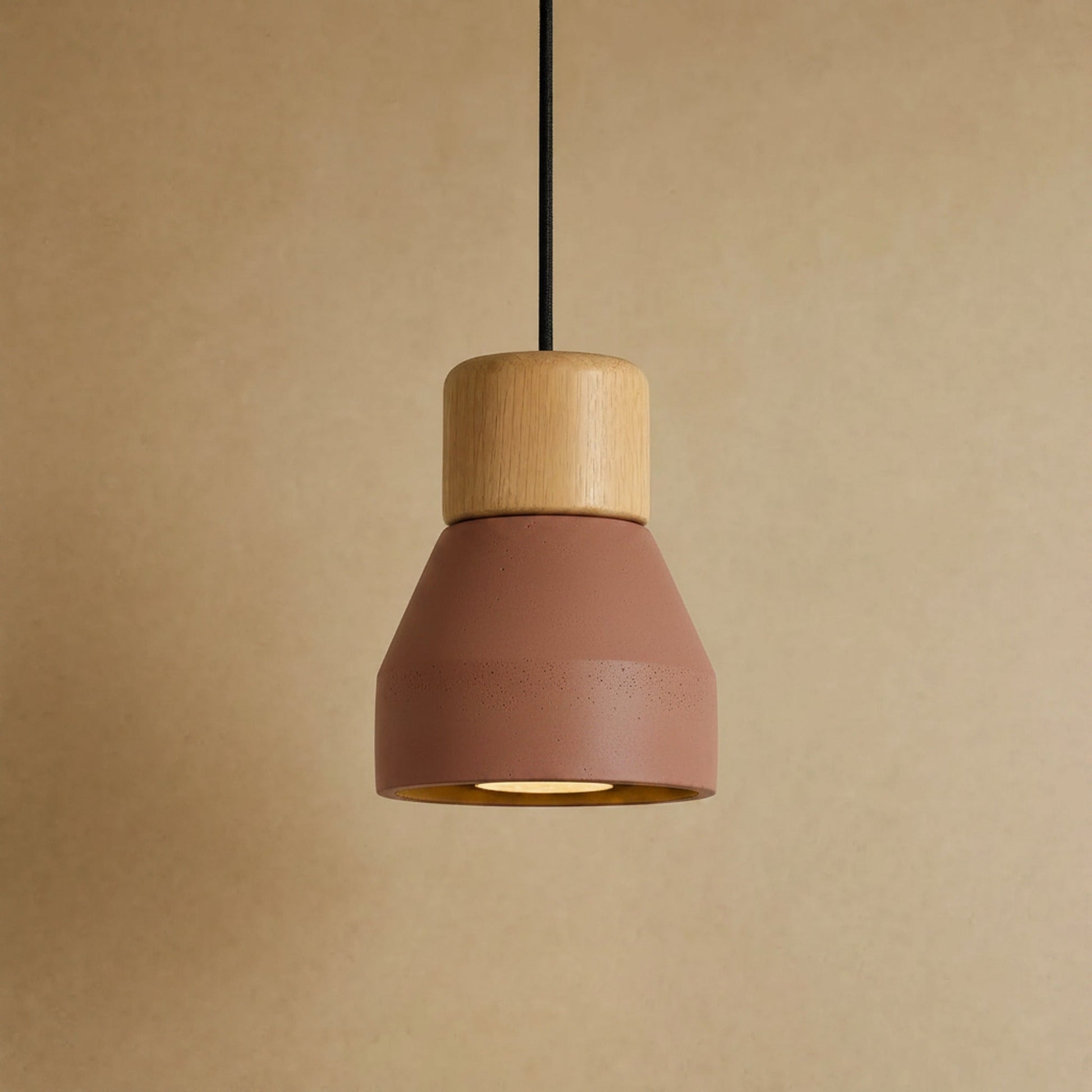 Asena concrete pendant light in Terracotta, raw cone with light wood cylinder | Wickleigh
