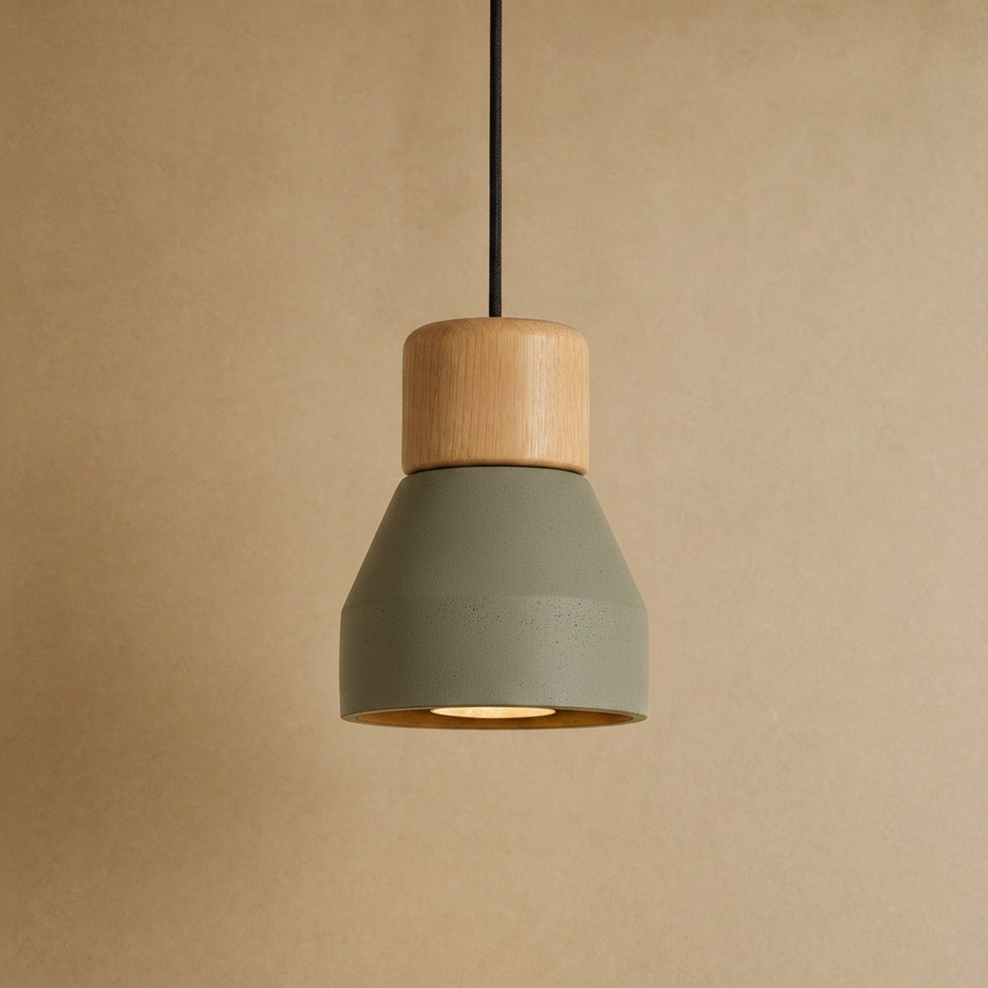 Asena concrete pendant light in Sage Green, raw cone with light wood cylinder | Wickleigh