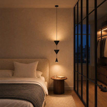 Silna black pendant light lit above a nightstand, bedroom with an industrial glazed partition at dusk | Wickleigh