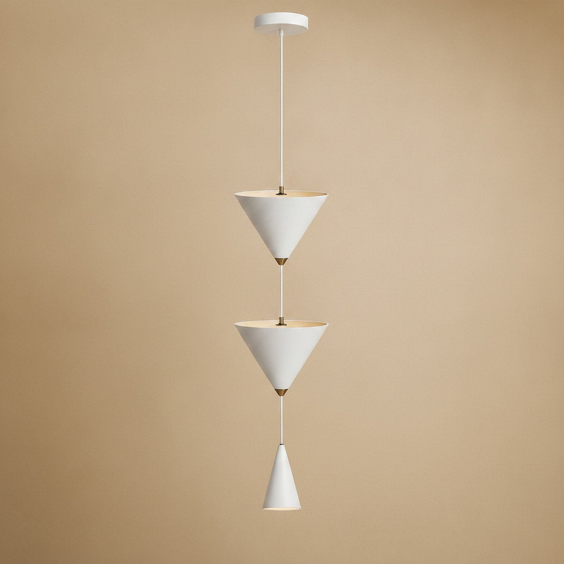 Silna white bedside pendant light, cascade of three cones on a single wire | Wickleigh