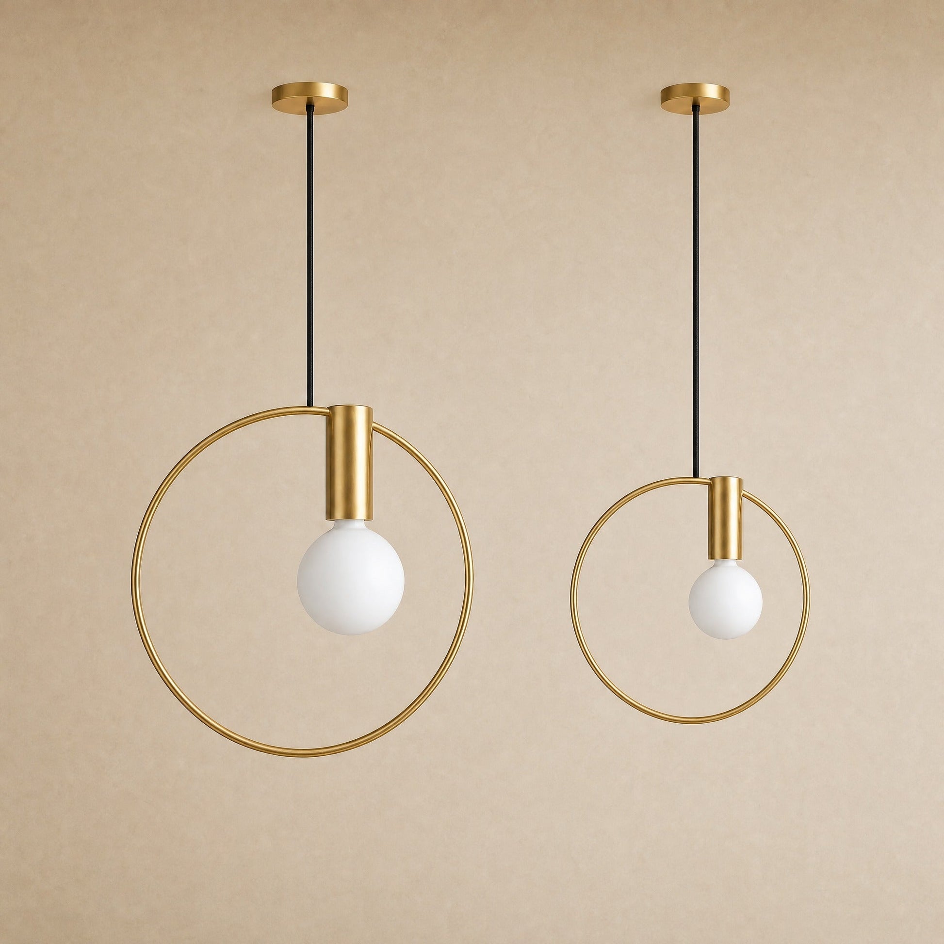 The two sizes of the Heden gold ring pendant light side by side | Wickleigh