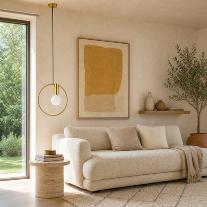 Heden gold ring pendant light above a travertine side table | Wickleigh