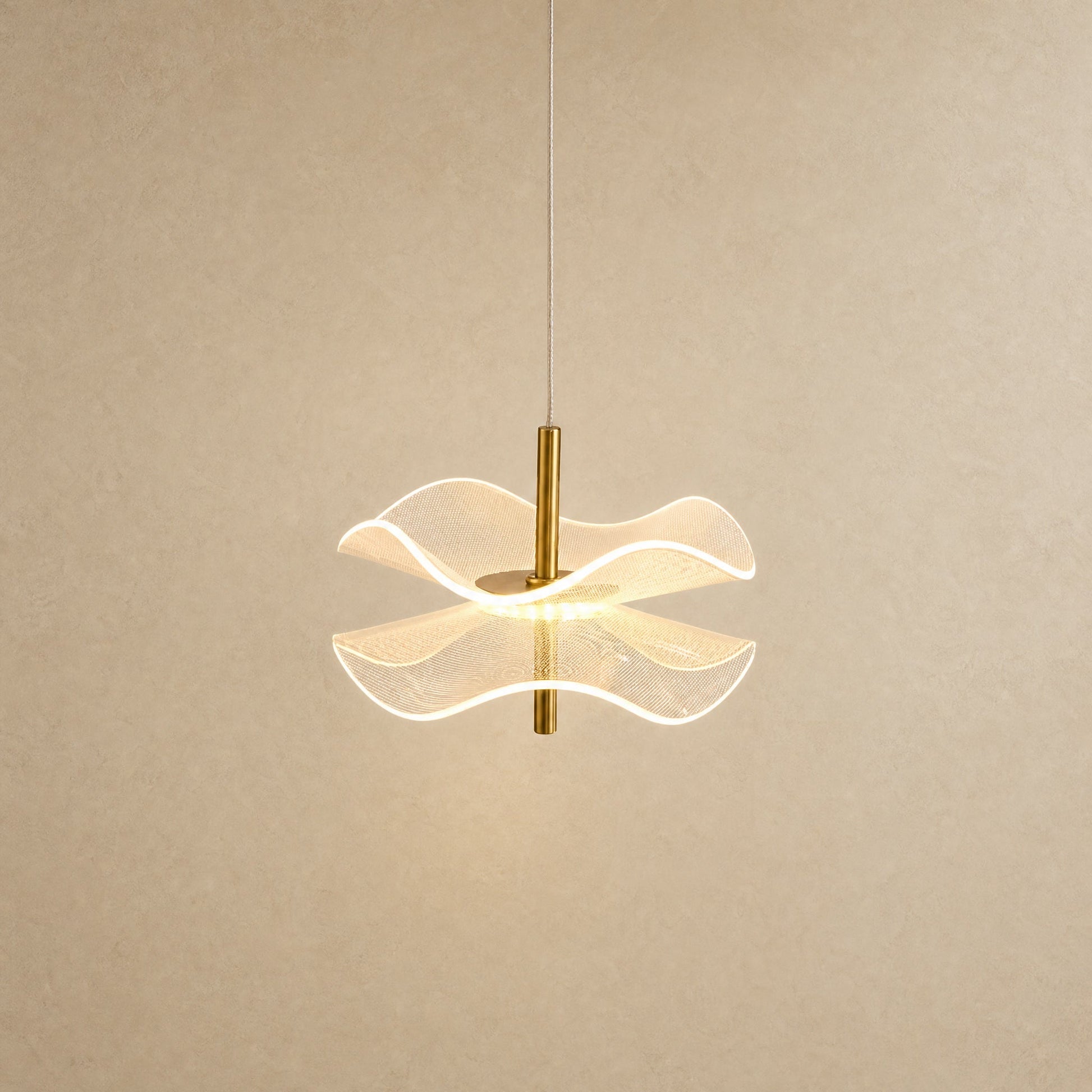 Orina flower pendant light, lit, two rippled acrylic discs on a gold rod | Wickleigh