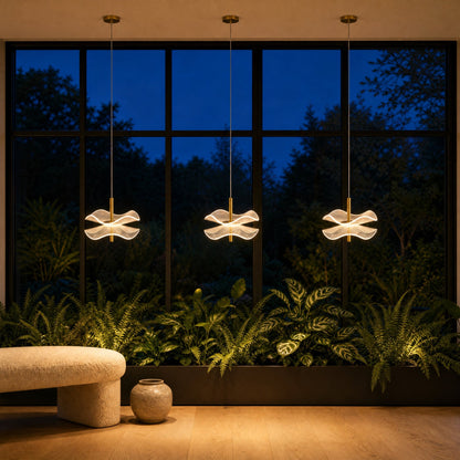 Three Orina flower pendant lights lined up as a curtain of light in front of black steel windows at dusk | Wickleigh