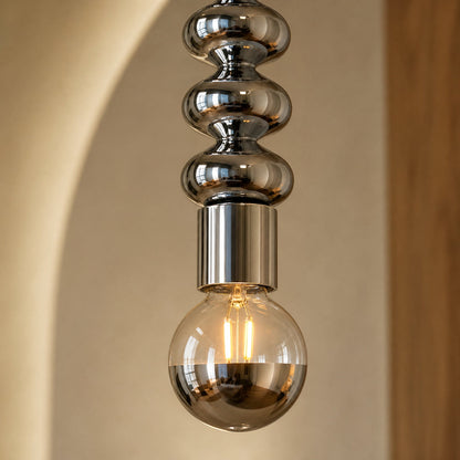 Detail of the chrome beads and lit half-mirror globe on the Kavlin pendant light | Wickleigh