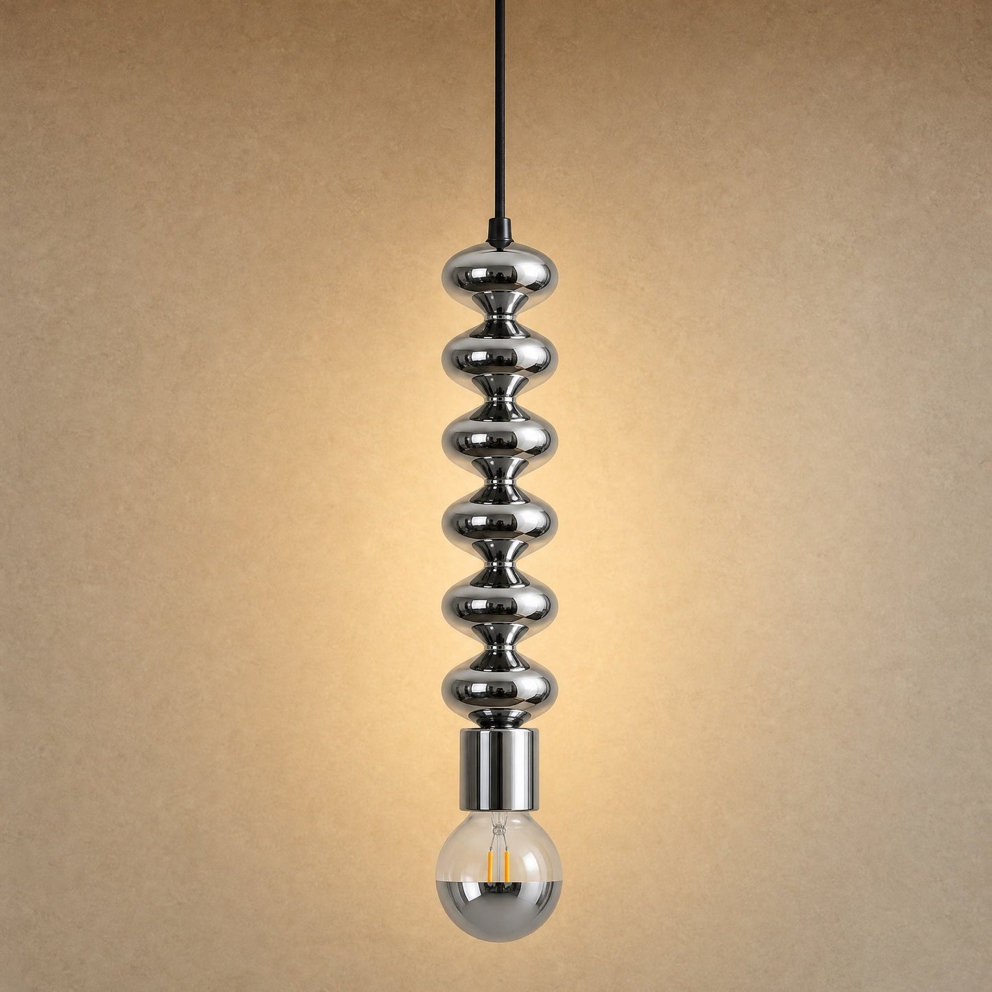 Kavlin pendant light in polished chrome with half-mirror globe | Wickleigh