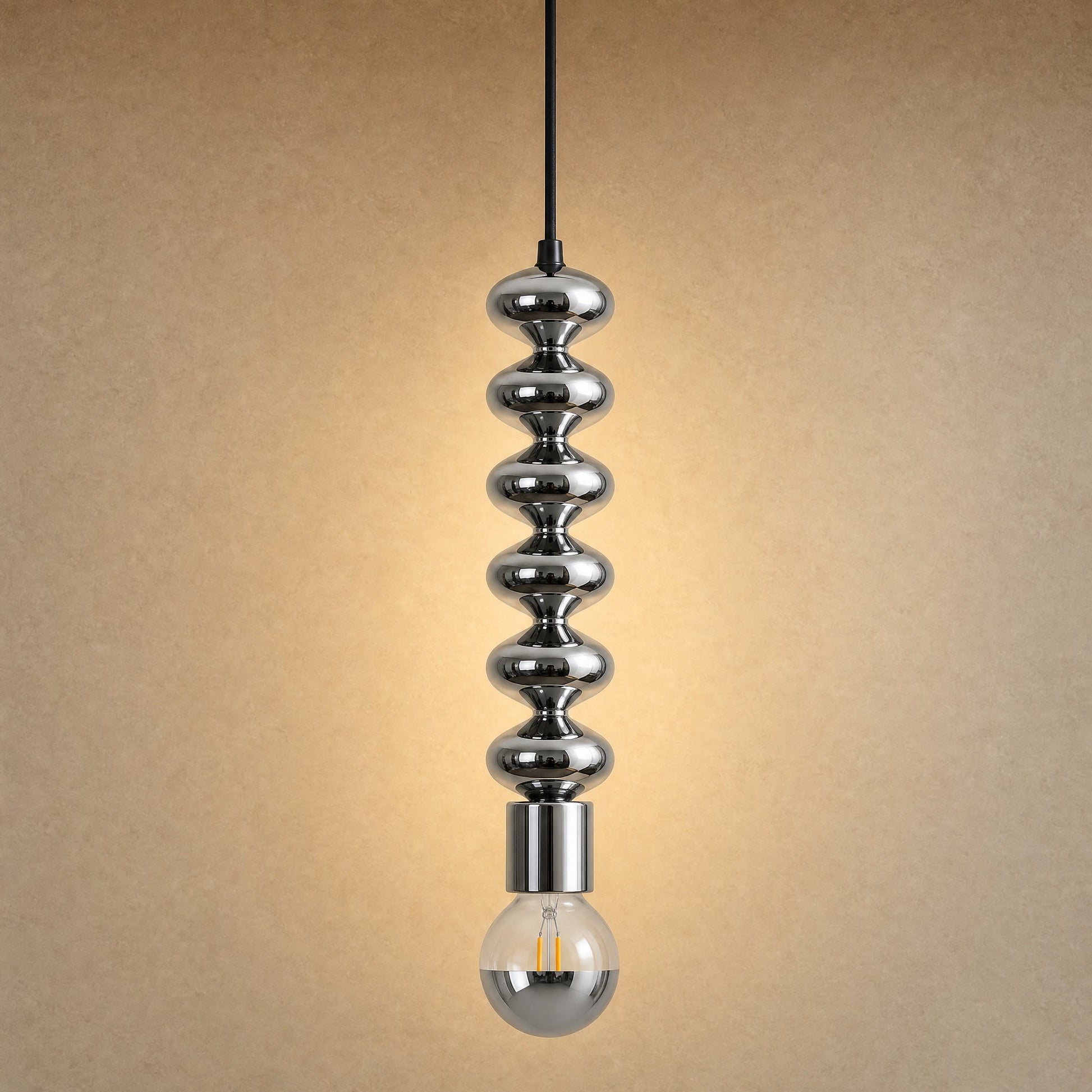 Kavlin pendant light in polished chrome with half-mirror globe | Wickleigh
