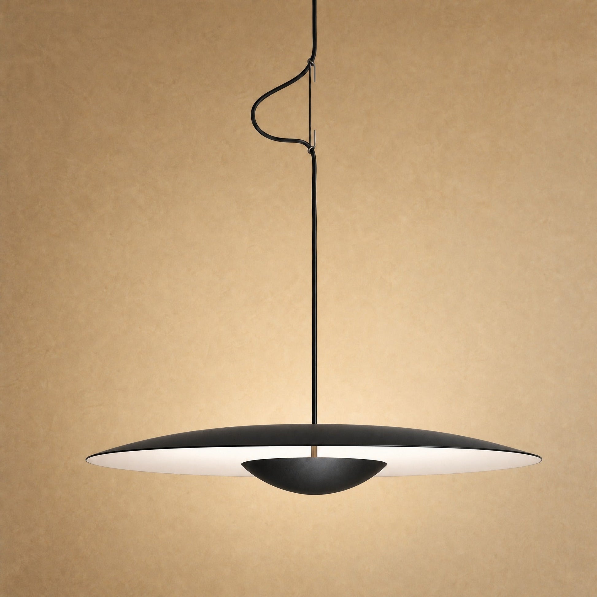 Fenna disc pendant light, matte black finish, black centre cup on a brass rod | Wickleigh